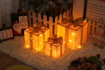 Three glowing Christmas gift boxes with orange bows on a fluffy white rug surrounded by festive holiday decor