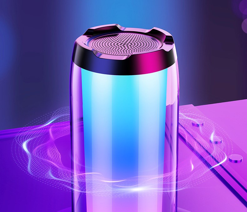Sleek cylindrical Bluetooth speaker with multicolor ambient lighting on a purple surface