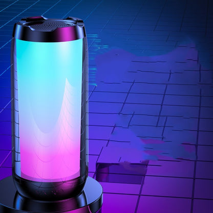 Modern ambient light Bluetooth speaker with gradient blue and pink LED on black surface