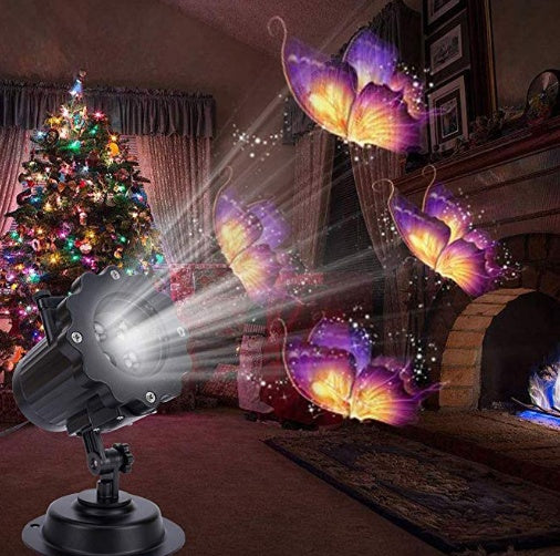 Outdoor LED laser projector light displaying purple and yellow butterfly patterns in a festive living room with Christmas tree and fireplace