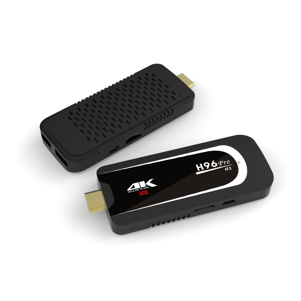 Two black H96 Pro H3 4K Ultra HD TV Box streaming sticks with HDMI connectors on white background
