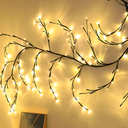 Warm white LED branch string lights hung on wall creating cozy ambient lighting
