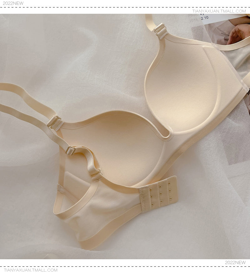 Beige wireless push-up bra with thin cups and adjustable straps on soft fabric