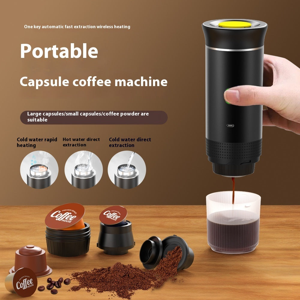 Hand holding black portable capsule coffee machine brewing coffee into cup, capsules and coffee grounds on wood table