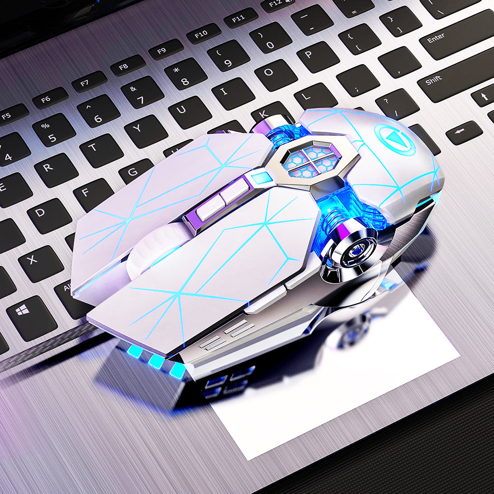 White wired gaming mouse with blue LED lights on a laptop keyboard with brushed metal finish
