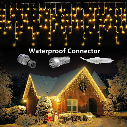 Warm white LED icicle Christmas lights with waterproof connectors decorating a snowy brick house exterior