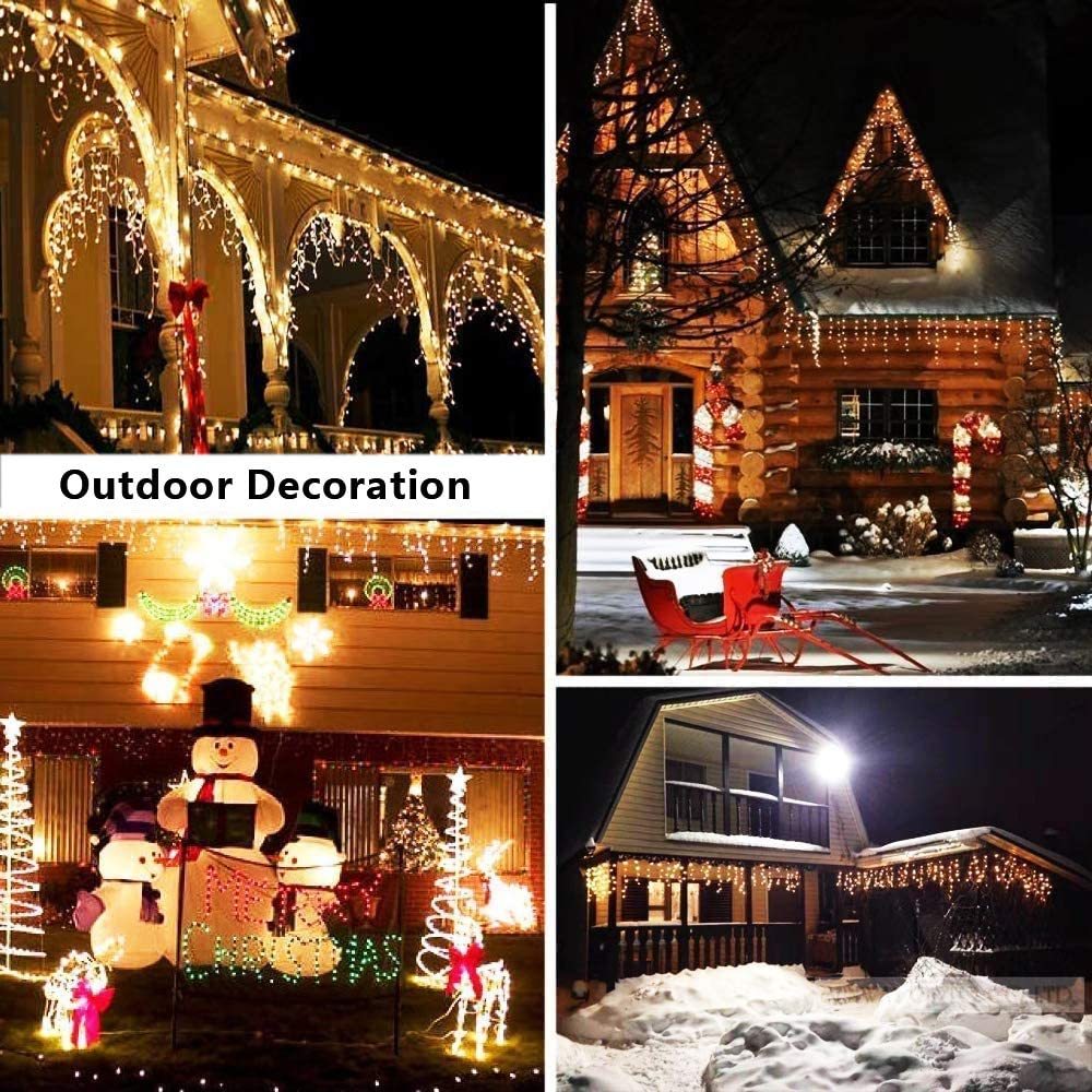 Outdoor Christmas decorations with warm white LED icicle lights on houses and festive snowman displays