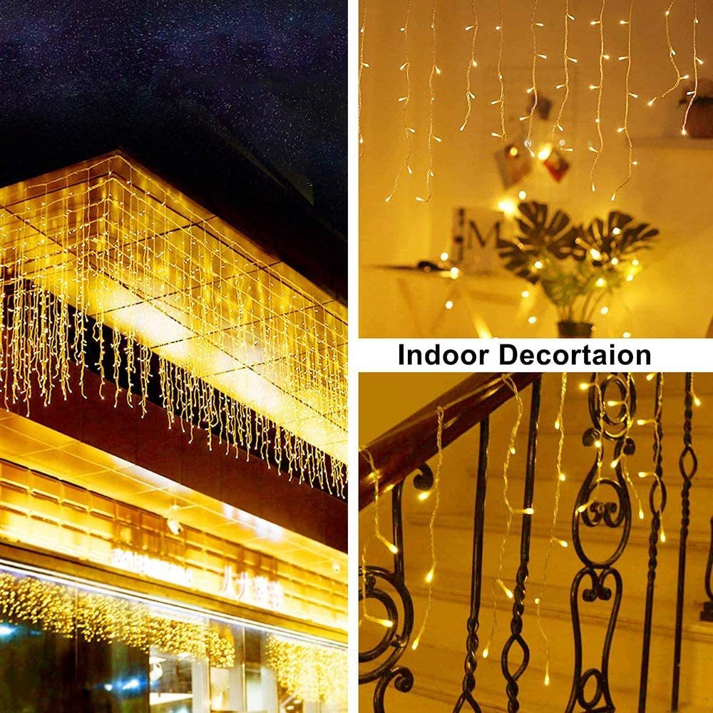 Warm white LED icicle string lights decorating outdoor building eaves and indoor staircase railing