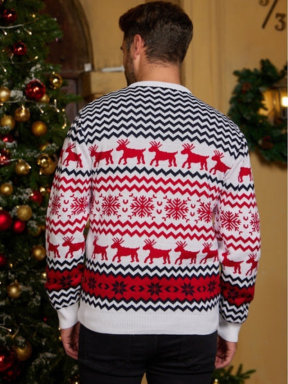 Man wearing white Christmas sweater with red reindeer and snowflake patterns by decorated tree