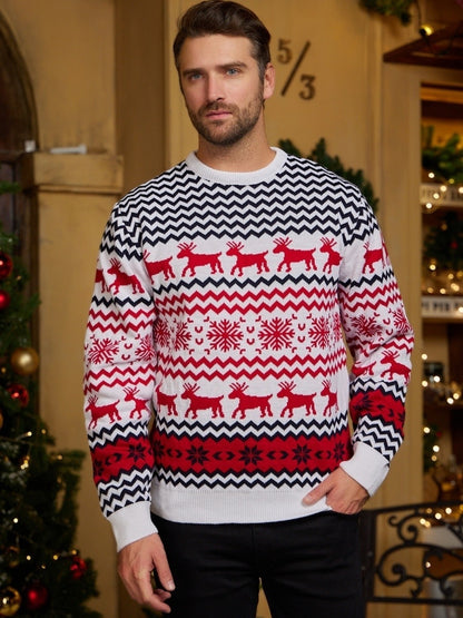 Man wearing white and red Christmas sweater with reindeer and snowflake patterns in festive indoor setting