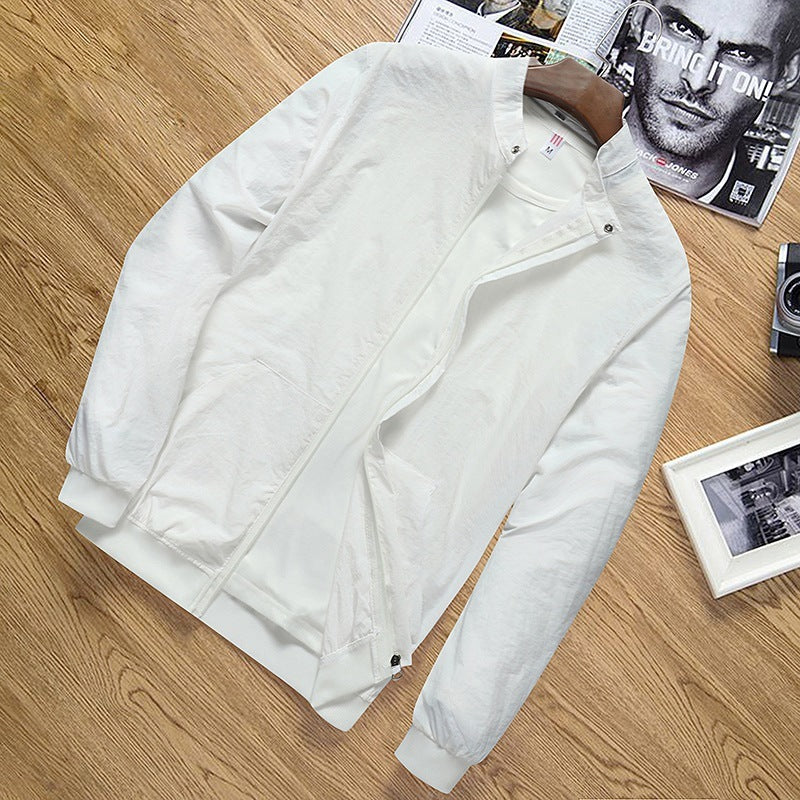 Lightweight white men's sun protection jacket with zipper and pockets on wooden surface