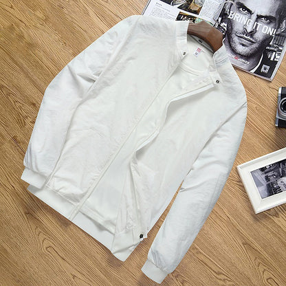 Lightweight white men's sun protection jacket with zipper and pockets on wooden surface