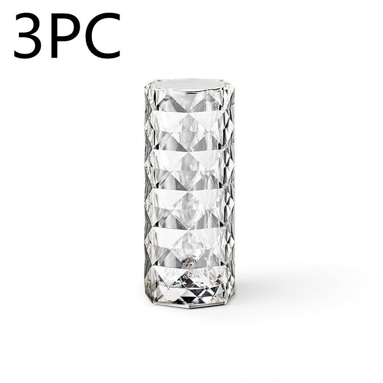 Clear crystal glass with geometric diamond pattern on white background