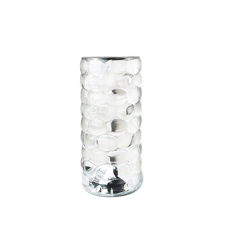 Clear glass vase with a textured bubble pattern on a white background