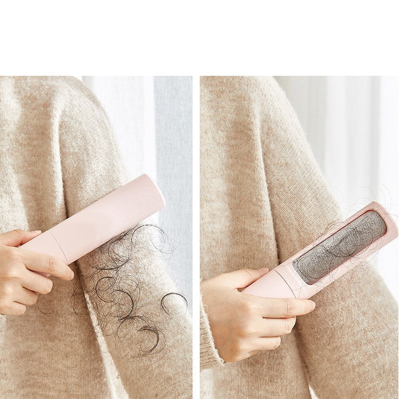 Person using pink self-cleaning pet hair remover brush on beige sweater with visible hair removal