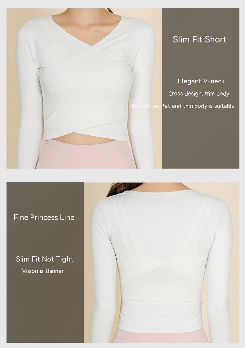 Woman wearing white slim fit V-neck long sleeve crop top with cross design and pink high-waist leggings