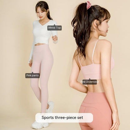 Women modeling pink nylon activewear three-piece set including sports bra, leggings, and white top for fitness
