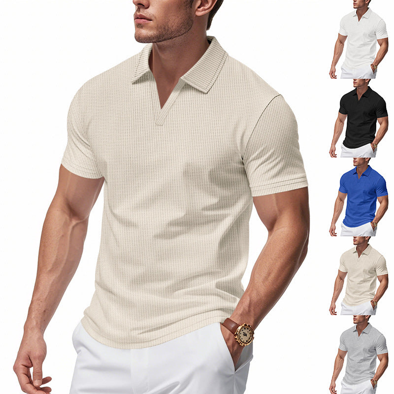 Man wearing beige slim-fit waffle polo shirt with V-neck and white pants, showcasing breathable summer top