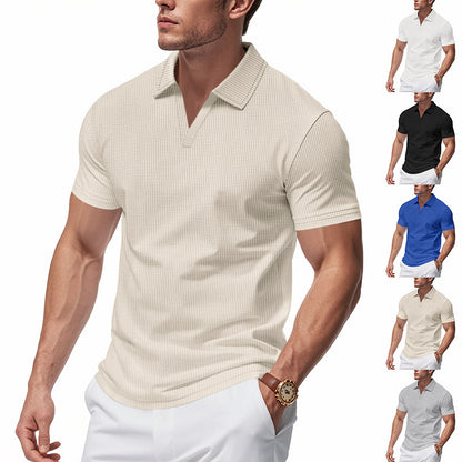 Man wearing beige slim-fit waffle polo shirt with V-neck and white pants, showcasing breathable summer top