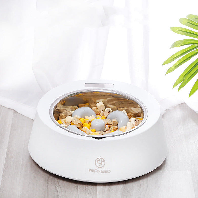 White smart pet food bowl with accurate portions, LED display, and detachable spoon on wooden floor
