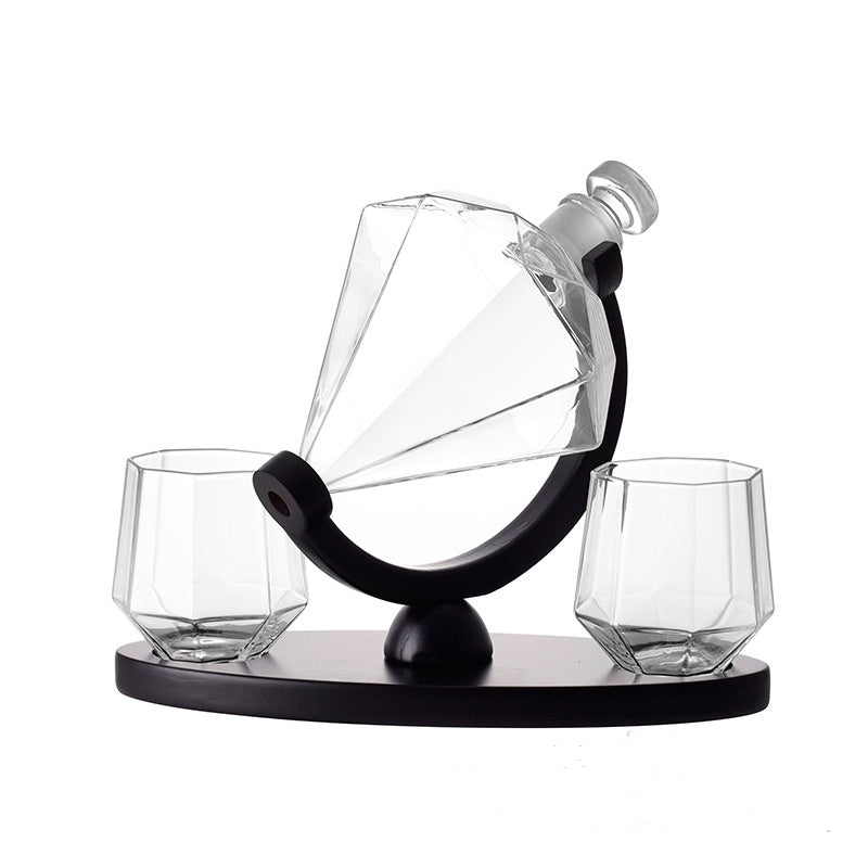 Diamond-shaped whiskey decanter and two matching glasses on black stand barware set