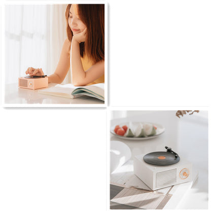 White Trendoligy retro mini phonograph Bluetooth speaker on table in bright room with book and fruit plate