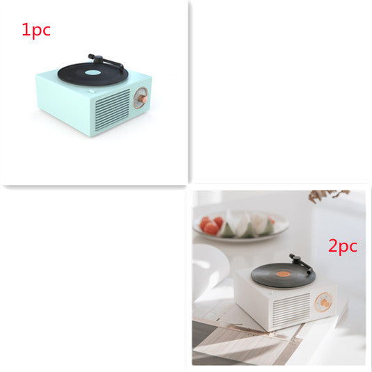Retro mini phonograph Bluetooth speaker in pastel green and white with wooden volume dial