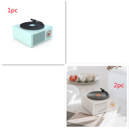 Retro mini phonograph Bluetooth speaker in pastel green and white with wooden volume dial