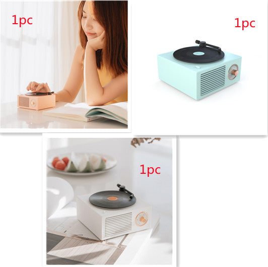 Retro mini phonograph Bluetooth speaker in pastel colors with vintage design and portable wireless audio