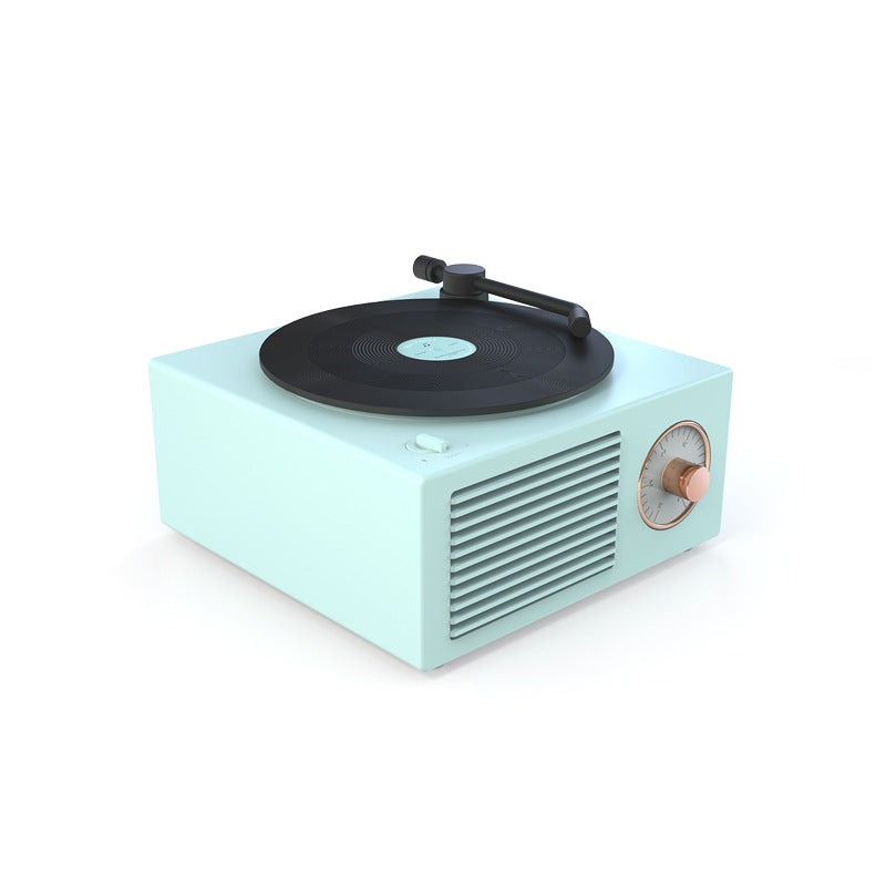 Retro mini phonograph turntable in light blue with black record and copper-tuned volume knob