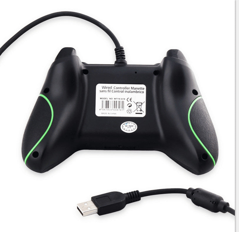 Back view of black wired USB game controller with green accents and textured grips on white background