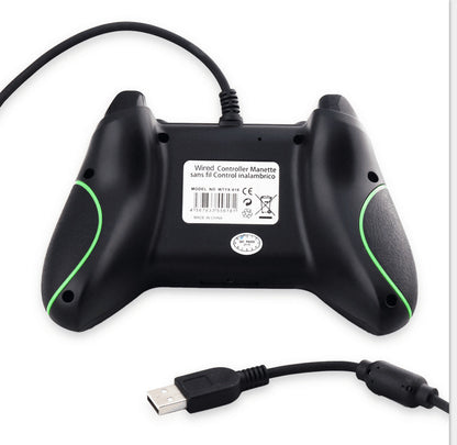 Back view of black wired USB game controller with green accents and textured grips on white background
