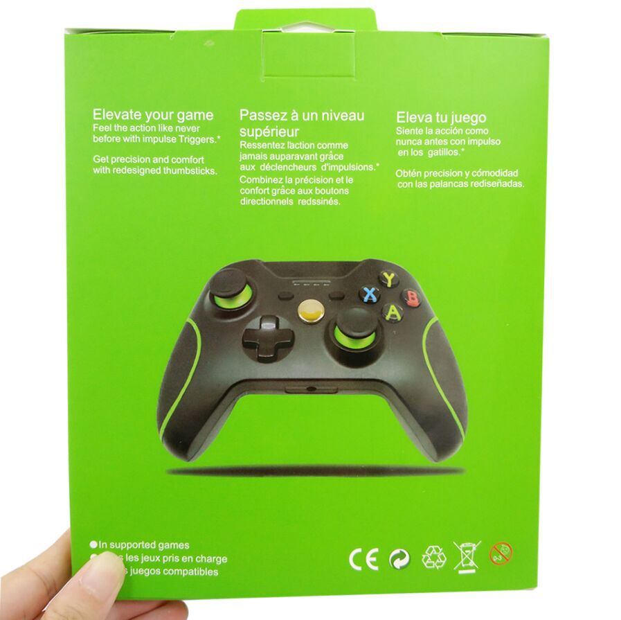Green packaging with black and green Xbox-style wireless game controller featuring colored buttons and redesigned thumbsticks
