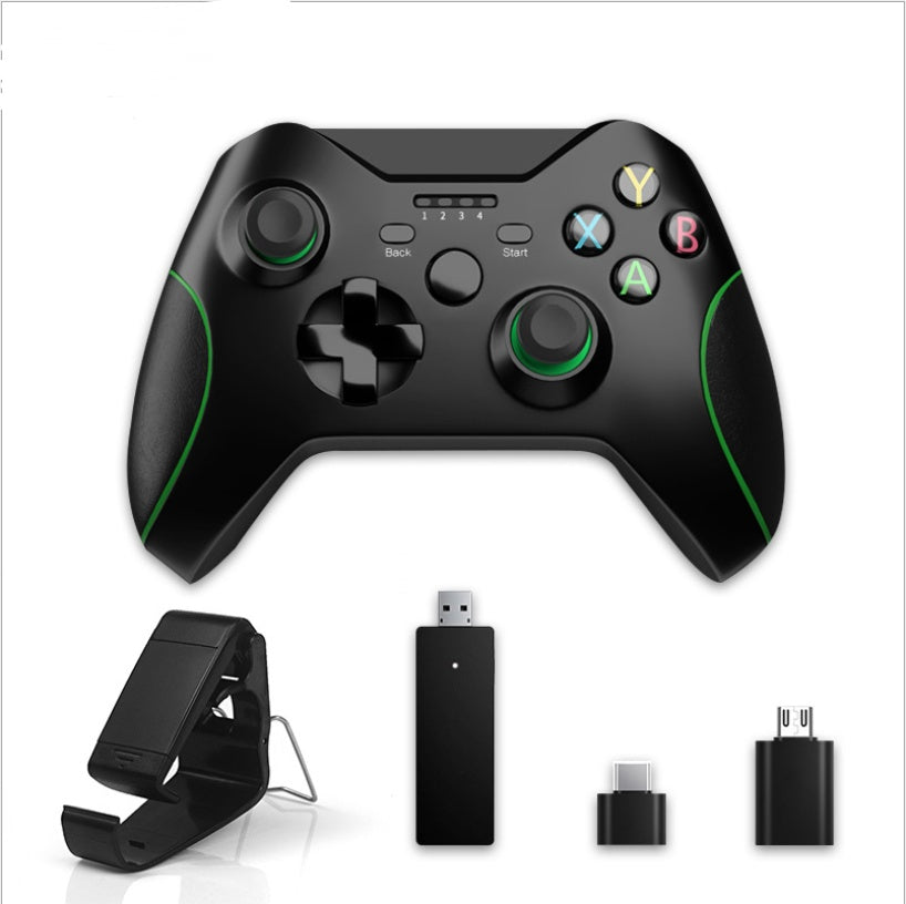 Black wired USB game controller with green accents, compatible with Xbox One and PC, plus USB adapters and clip
