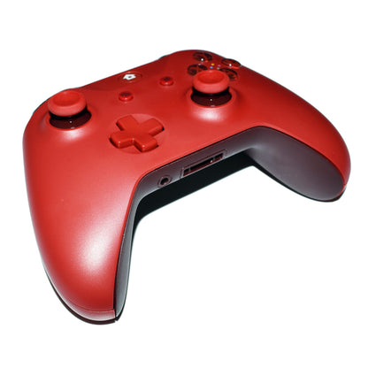 Red wireless gaming controller with joystick and buttons on white background