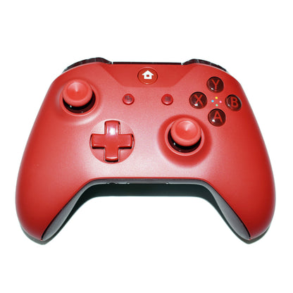 Red wireless gaming controller with dual analog sticks, D-pad, and ABXY buttons on white background