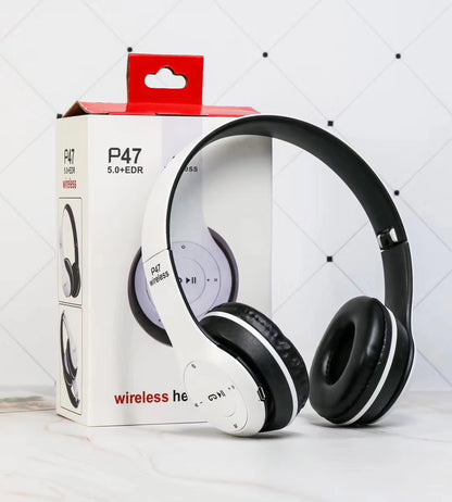White and black P47 wireless Bluetooth headphones with packaging box on white surface