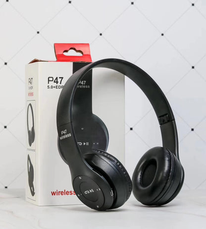 Black P47 wireless Bluetooth headphones with foldable design and control buttons, standing by product box