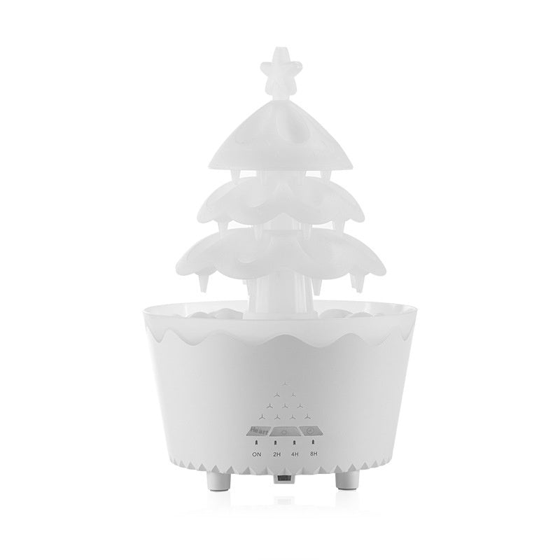 White Trendoligy aroma diffuser shaped like a Christmas tree with remote control and timer settings