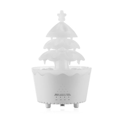 White Trendoligy aroma diffuser shaped like a Christmas tree with remote control and timer settings