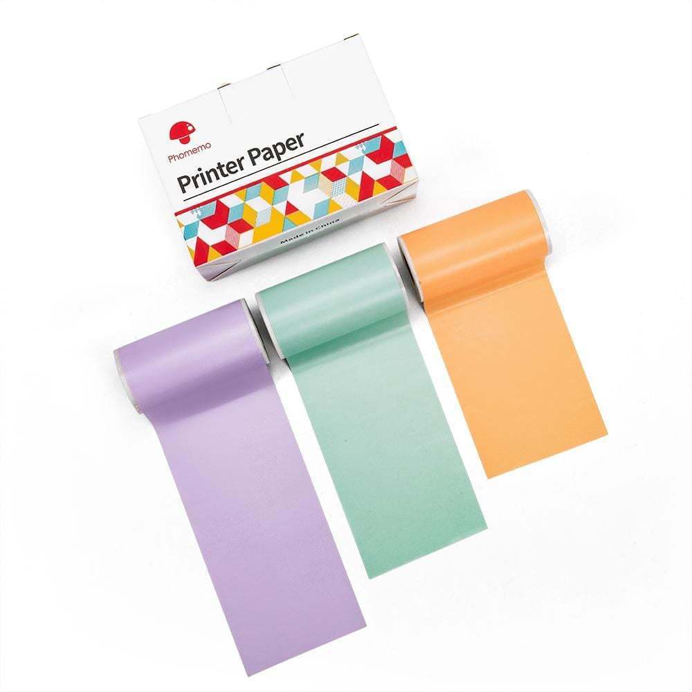 Phomemo printer paper box with three colored thermal paper rolls in purple, green, and orange on white background
