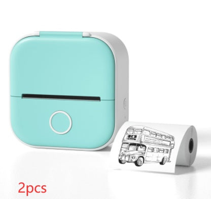 Compact light blue portable mini thermal printer printing black and white bus image on photo paper
