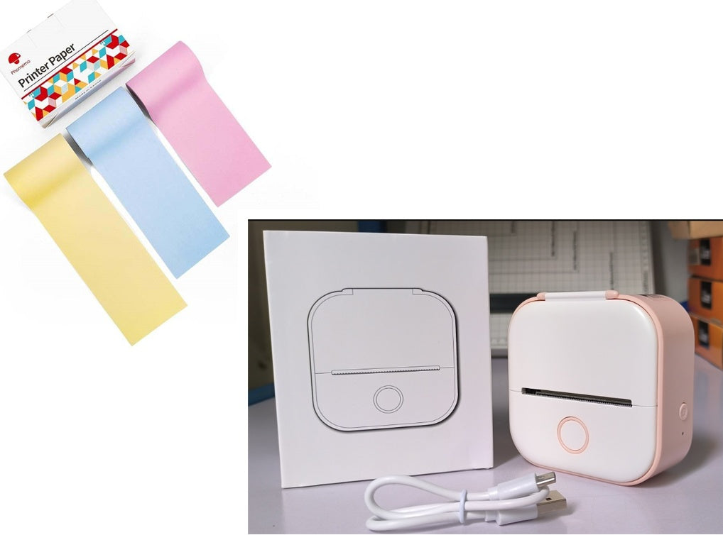 Compact white and pink portable thermal printer with USB cable and boxed packaging on table
