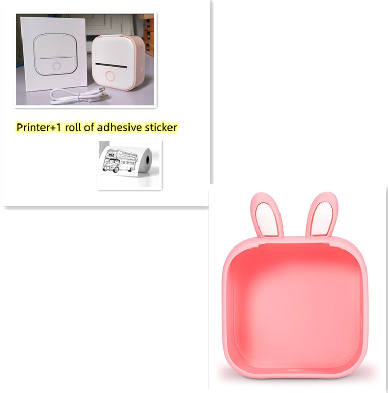 White and rose gold portable mini thermal printer with USB cable and packaging box on gray surface