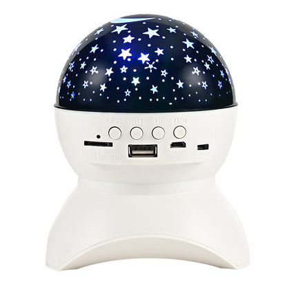 White Bluetooth speaker with star projector night light and control buttons on front