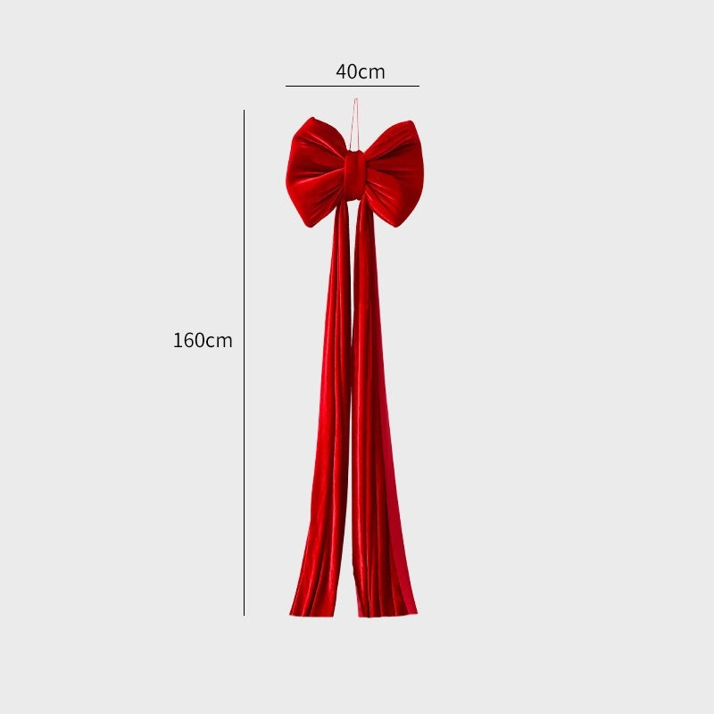 large red velvet Christmas bow decoration 40x160cm with long hanging tails on white background