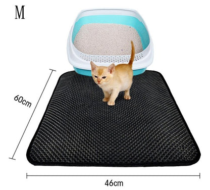 Medium black waterproof cat litter mat 60x46cm with a cream kitten and blue litter box