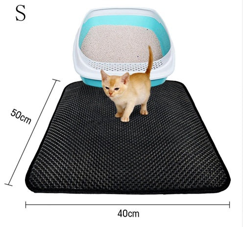 Small black waterproof cat litter mat 40x50cm with a kitten standing next to a blue cat litter box