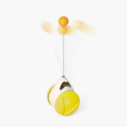 Interactive yellow catnip toy with suction cup base and spinning orange ball on white background