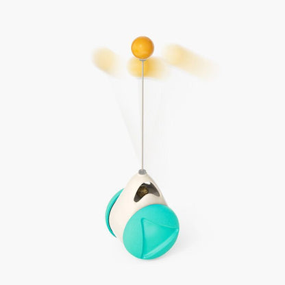 Interactive cat toy with turquoise wheels, white base, and spinning yellow ball on wire